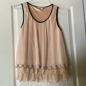 Small woman’s beaded sleeveless blouse
